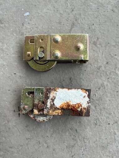 New and worn sliding door roller assemblies