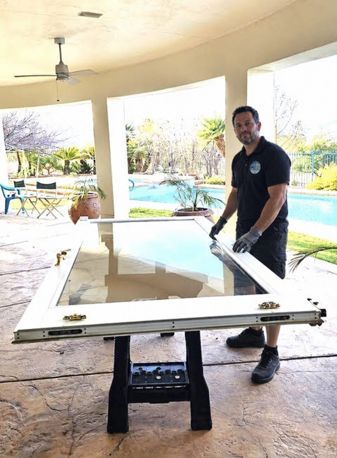 A technician handling a sliding door panel near Ocoee