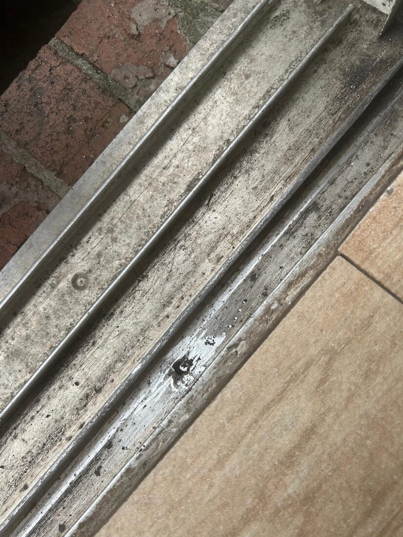 A worn sliding door track